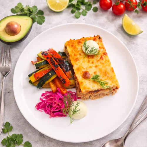 Chicken Enchilada, Charred Zucchini and Capsicum, Pickled Red Onion and Cabbage, Avocado and Sour Cream Sauce