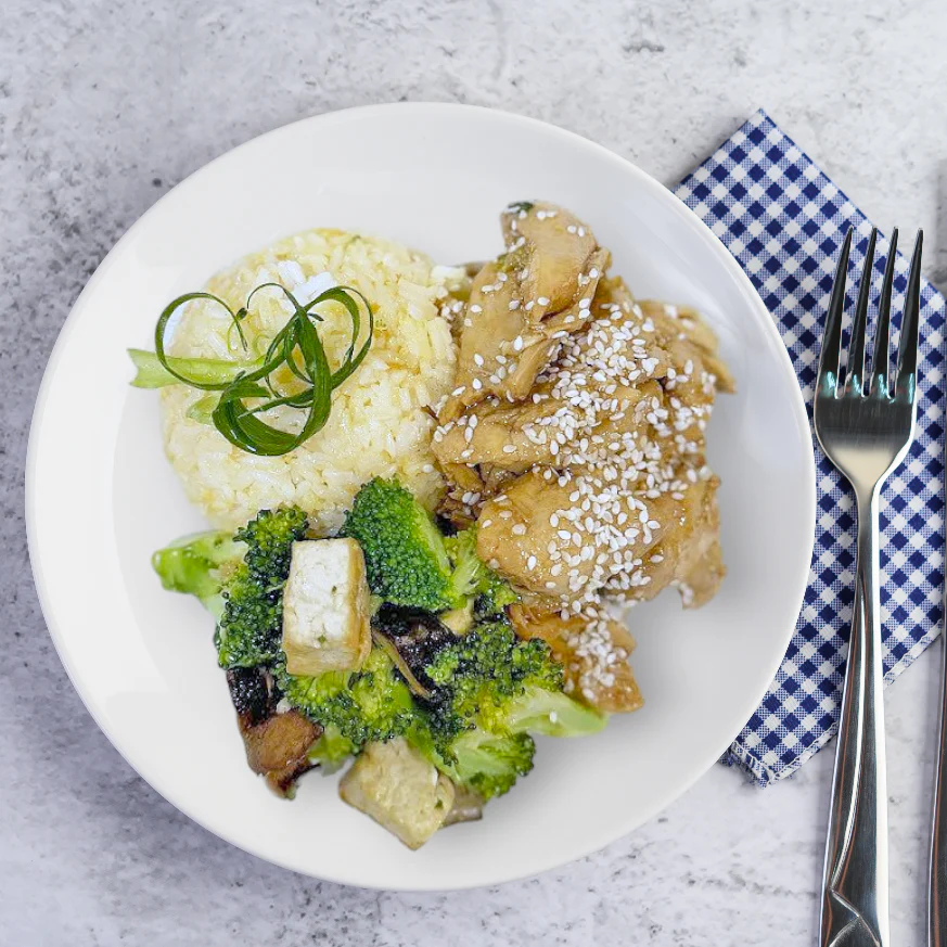 Stir fry Sesame Chicken with Egg Fried Jasmine Rice and Veggies